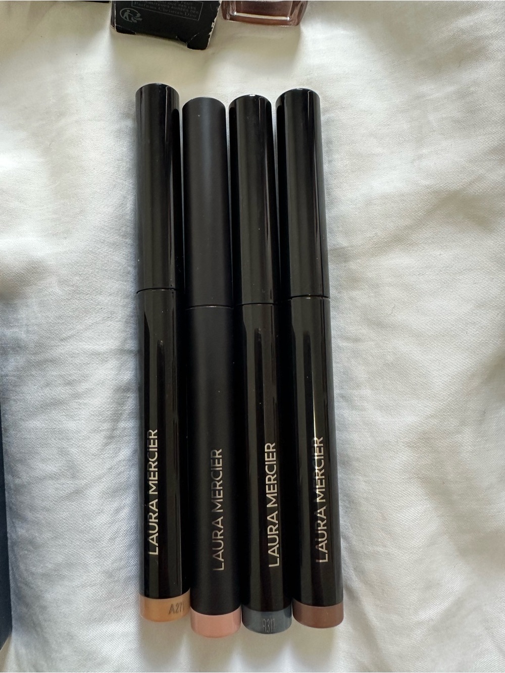 Laura Mercier Stick Eyeshadows: Dune, Celectial Noir, Strapless, Rosegold